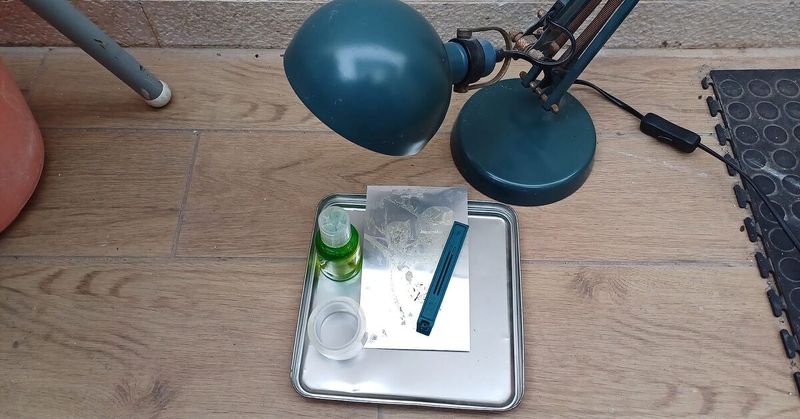 Set up a shallow soapy-water pan
