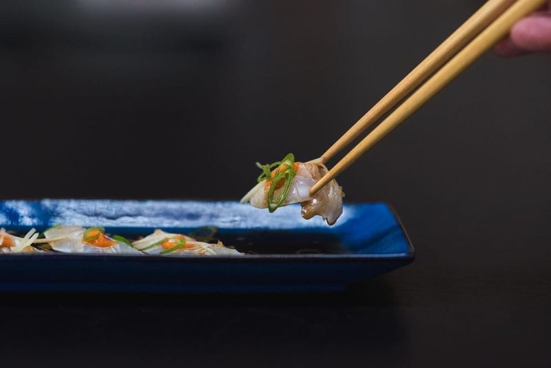 Touching shared food with your personal utensils