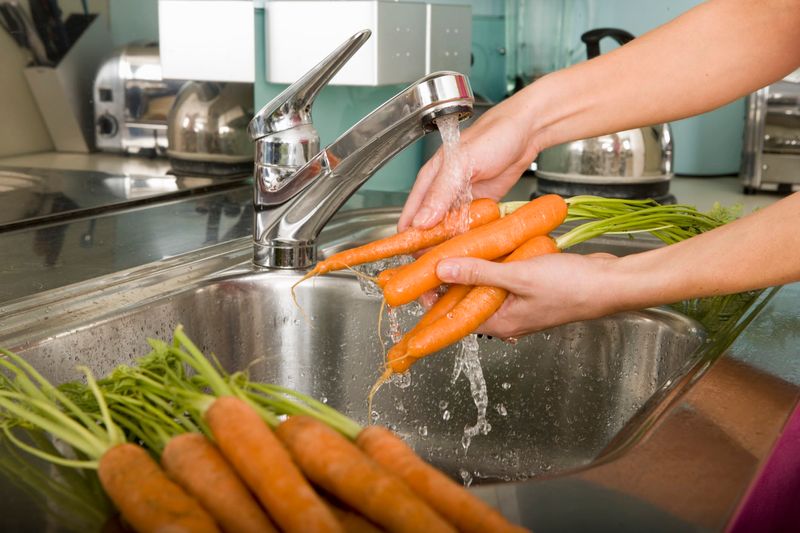 Scrubbing Carrots Clean Before Storing