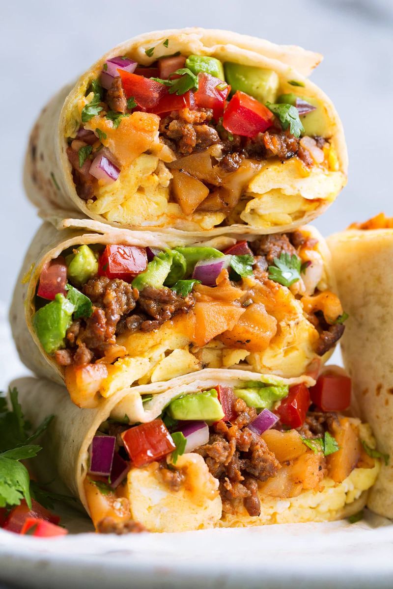 Breakfast burritos with eggs, potatoes, and salsa