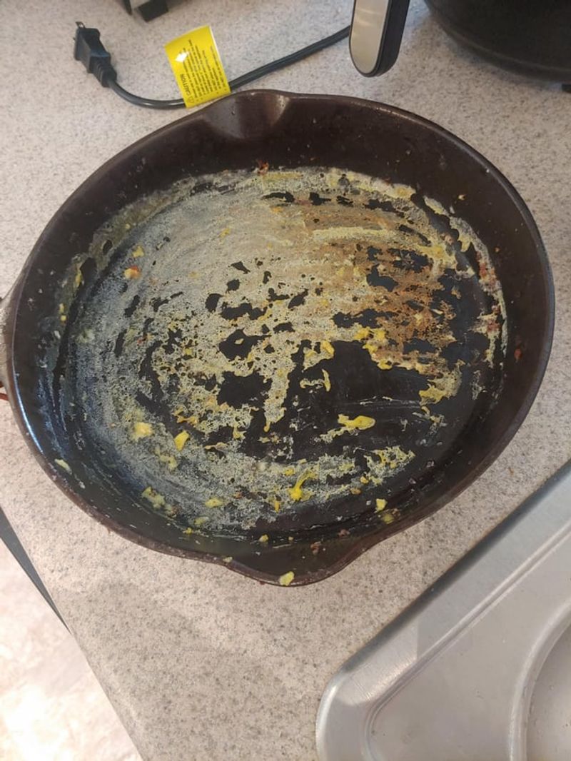 Eggs in a not-yet-seasoned pan