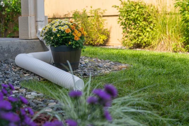 Redirect and disperse roof runoff before planting