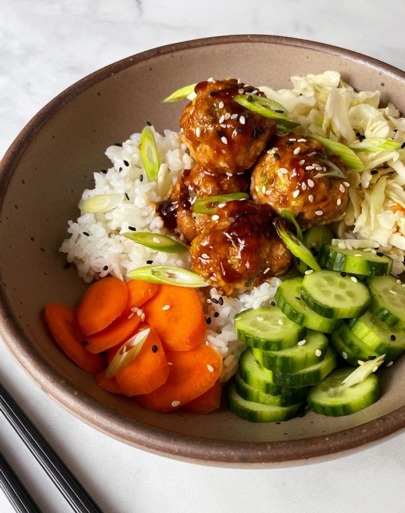 Honey garlic chicken meatballs with sesame cabbage slaw