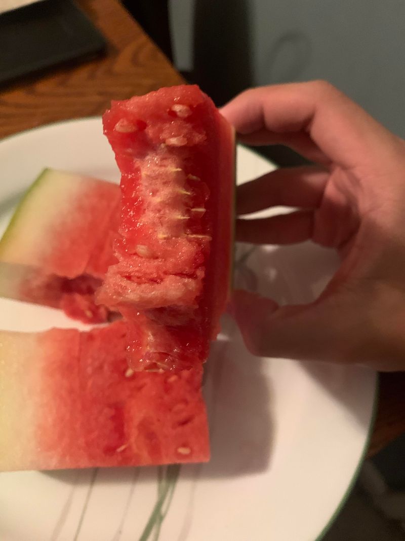 White fuzz or visible mold on cut fruit