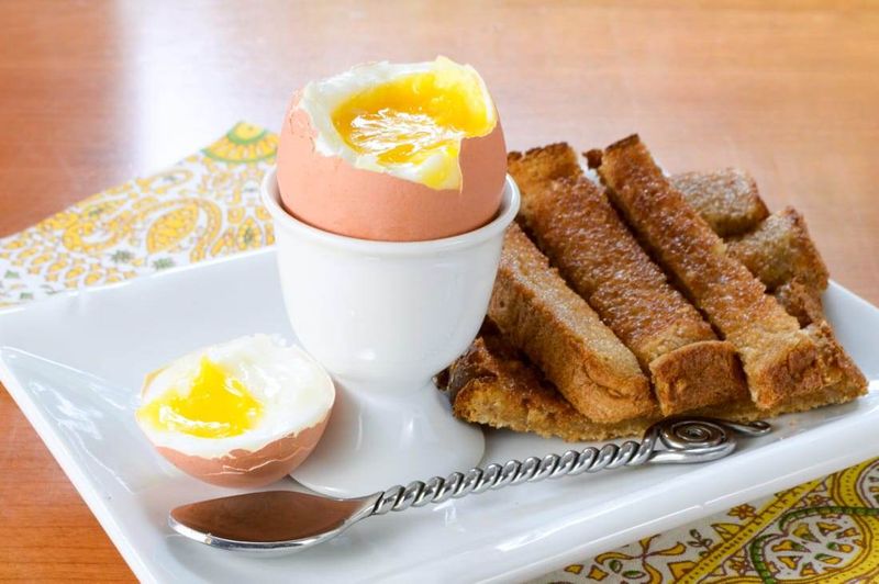 Soft scrambled eggs with buttered toast soldiers