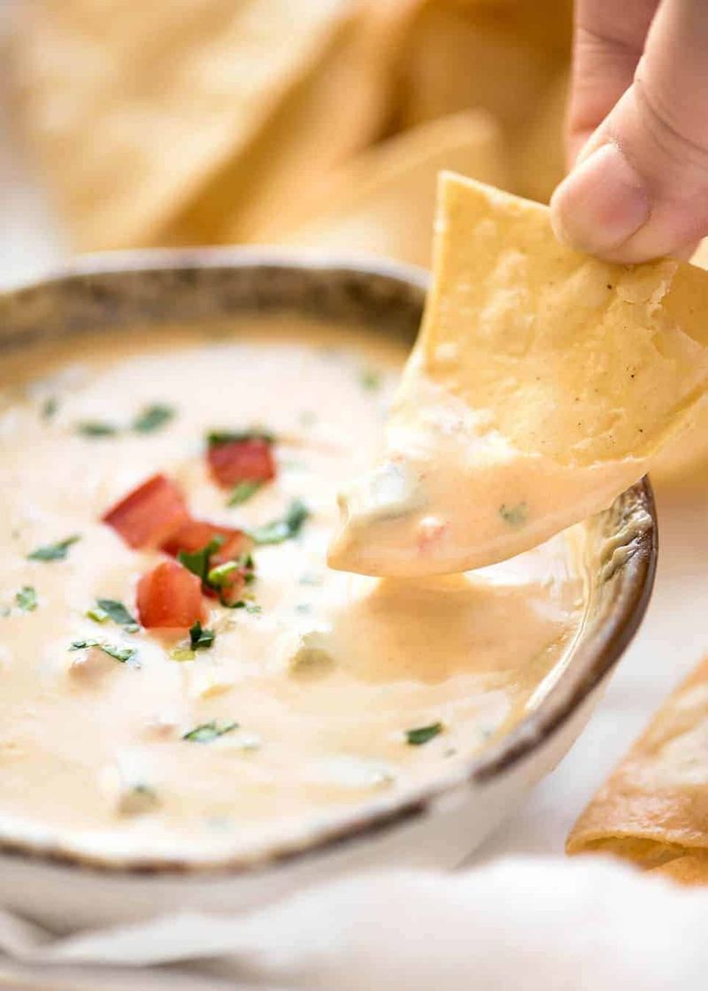Expecting Yellow Shredded Cheese or Orange Queso Dip