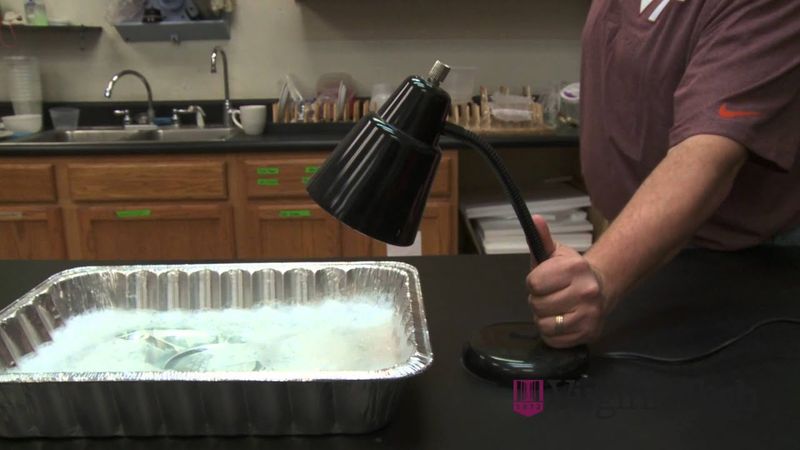 Set up a pan of soapy water and aim a light into it