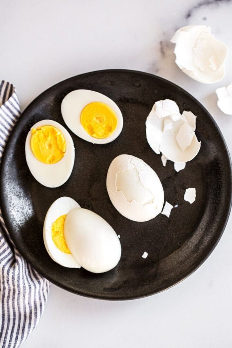 Hard-Boiled Eggs And A Piece Of Fruit