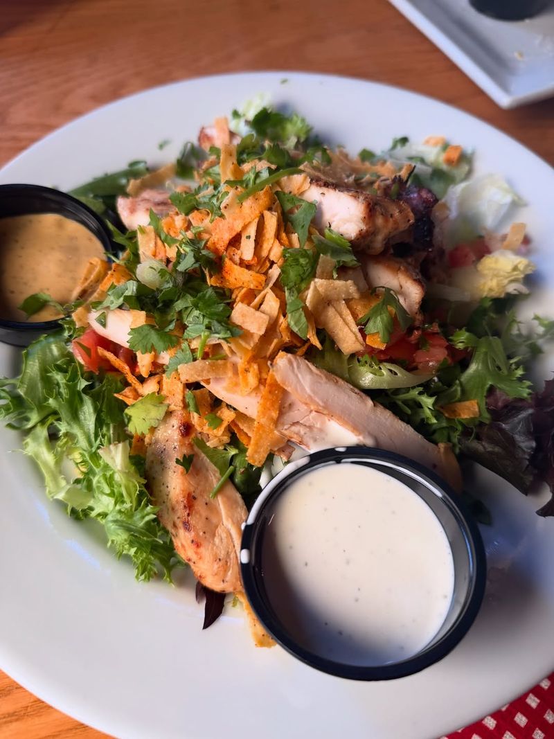 Ordering a salad without asking about the dressing portion