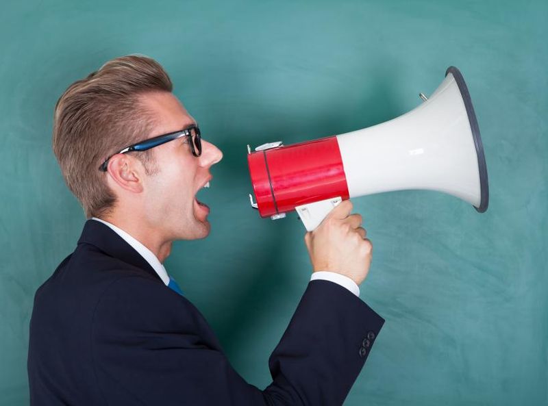 Talking loudly like you own the room