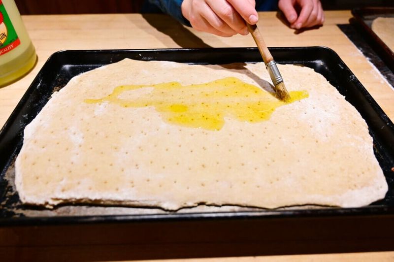 Brush the crust with something tasty