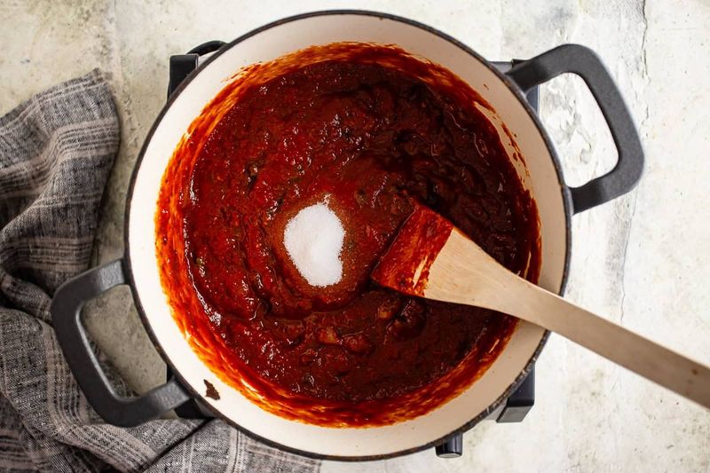 Adding A Pinch Of Sugar To Tomato Sauce