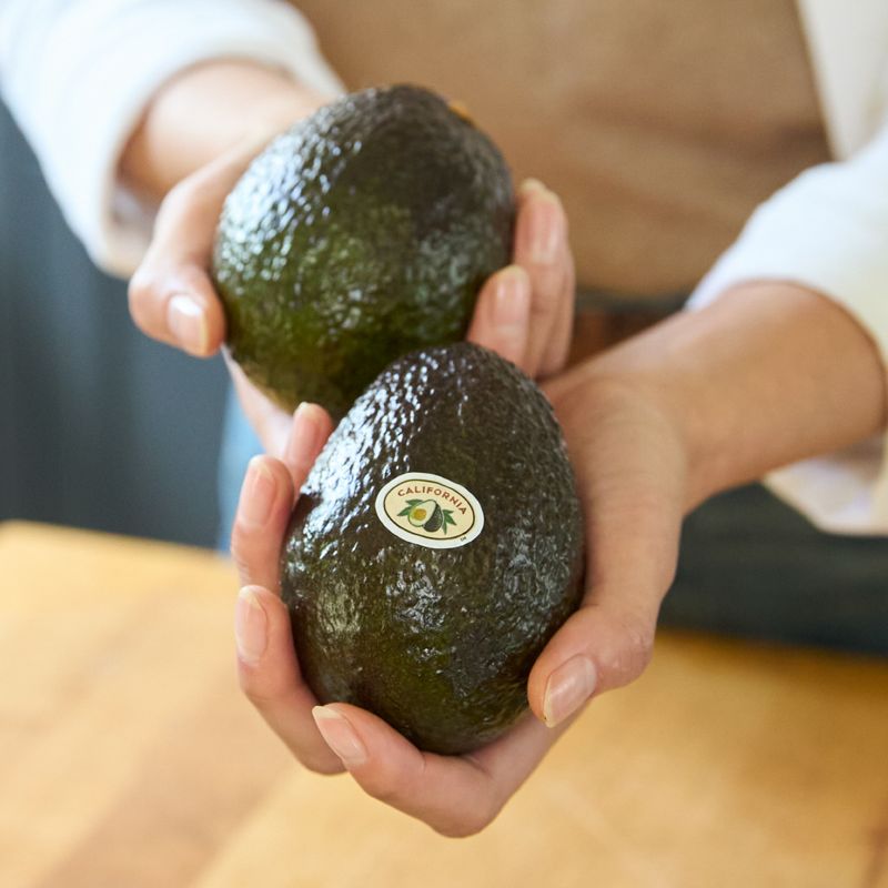 Squeezing them like you’re testing a stress ball