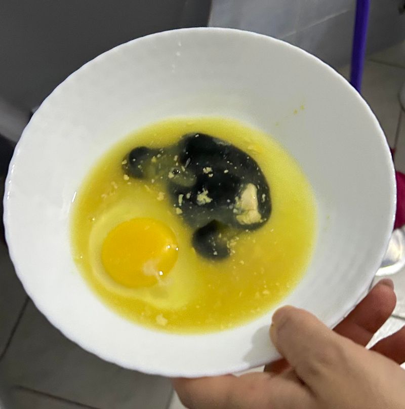 Off-color yolk with smell