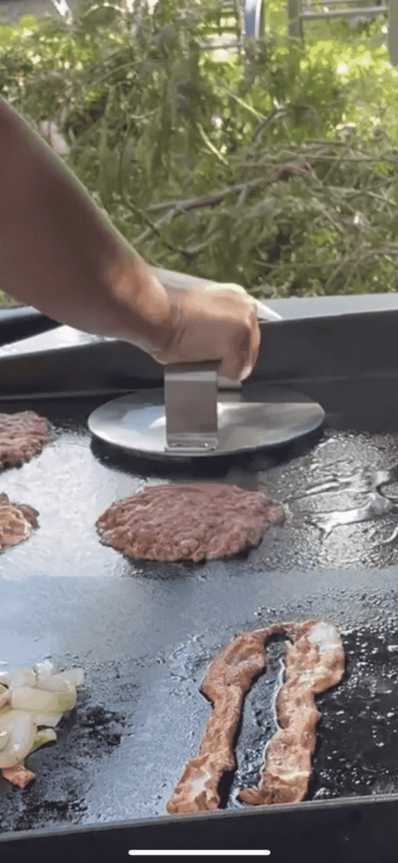 Pressing burgers to speed cooking