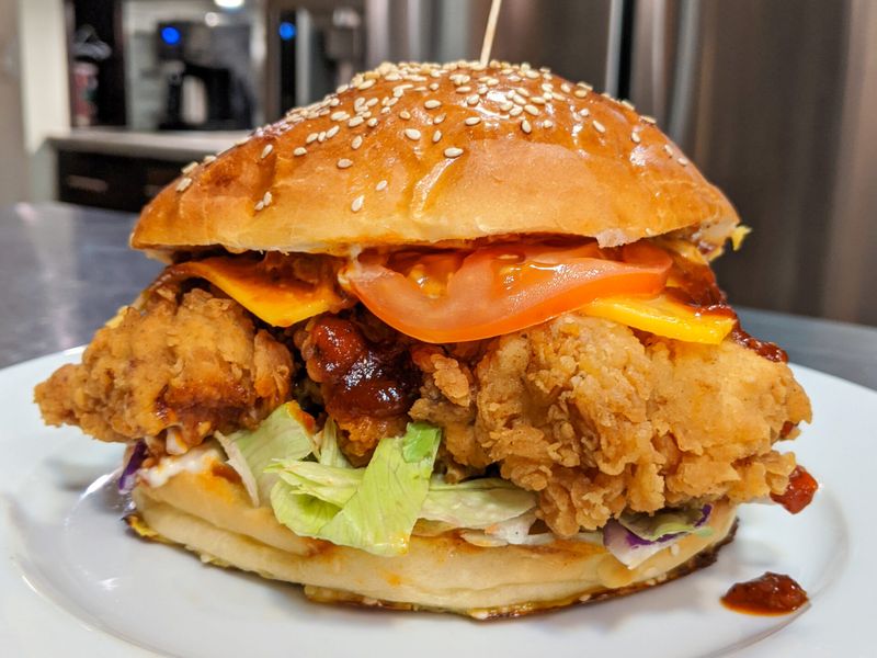 Fried chicken sandwiches piled with sauces
