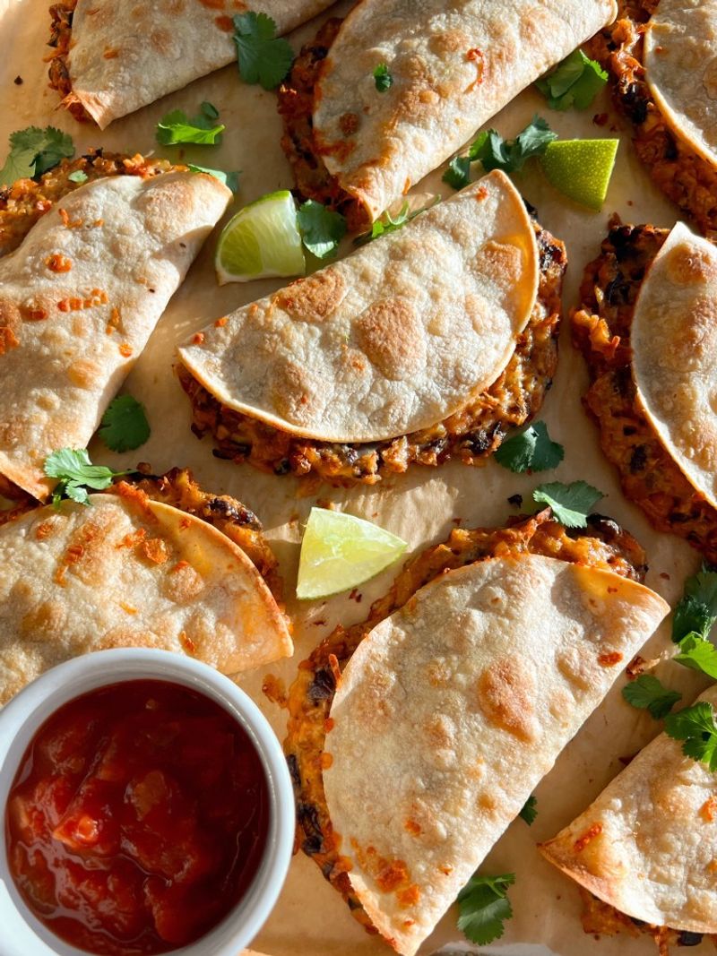 Crispy Bean and Cheese Tacos With Lettuce and Salsa