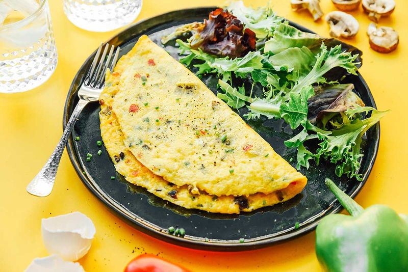 Veggie omelet with a side salad