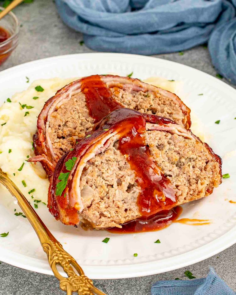 Bacon fat or a strip of bacon on top