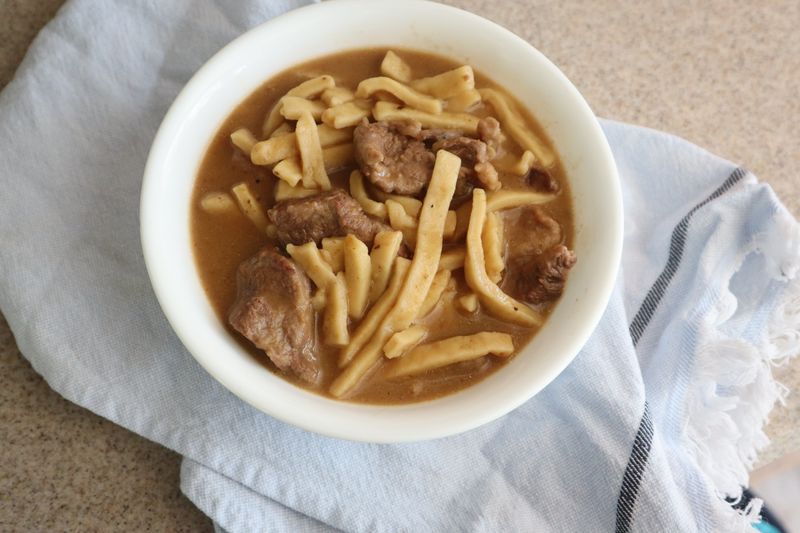 Beef and Noodles Over Mashed Potatoes