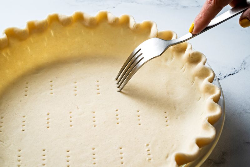 Dock the crust for blind baking