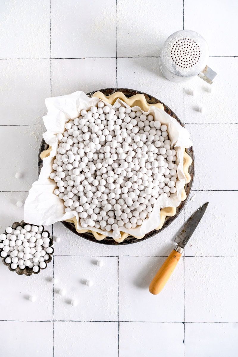 Use pie weights or dry beans or rice