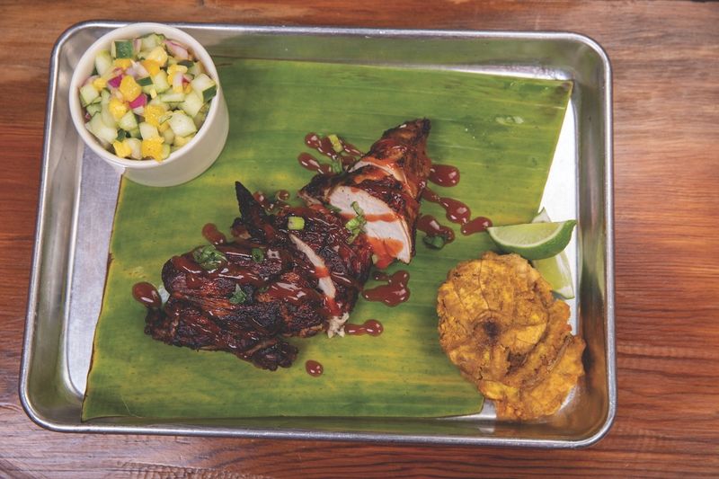 Jerk chicken meat and two at Riddim N Spice