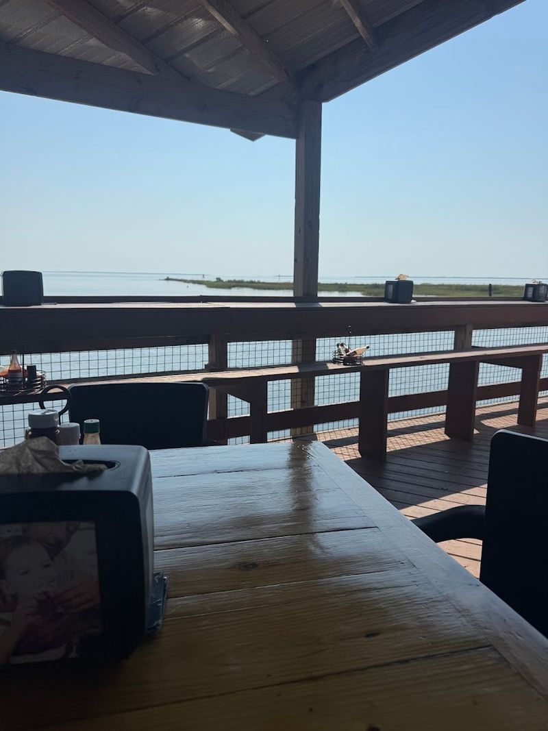 Waterfront Deck Where You Toss Shells Straight Into the Bay
