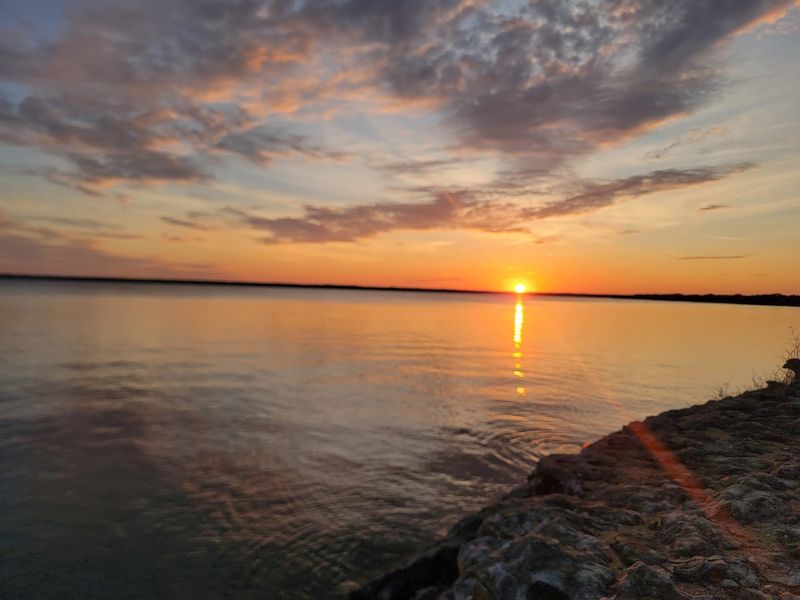 Watch Spectacular Sunsets Over the Lake from Your Campsite