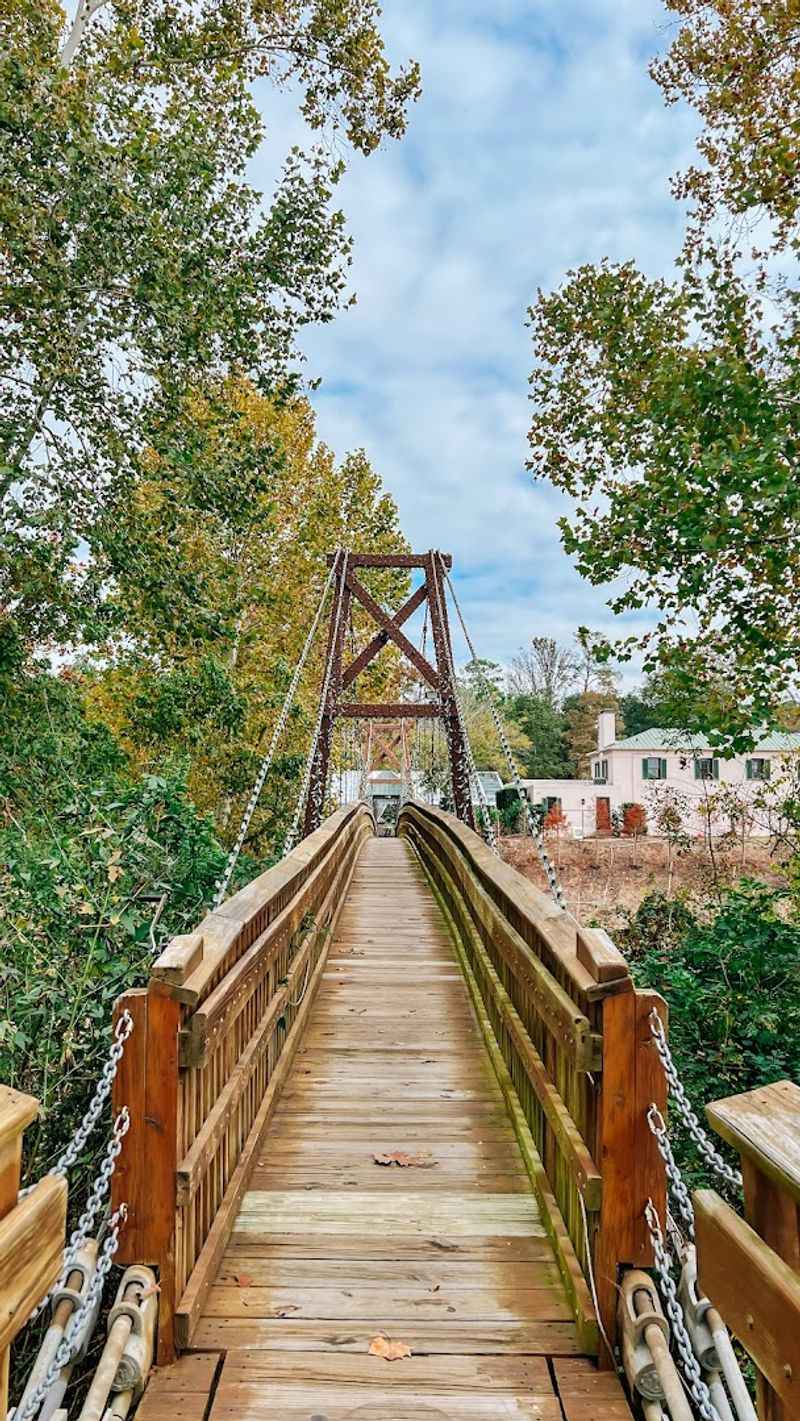 Crossing the Woodland Suspension Bridge