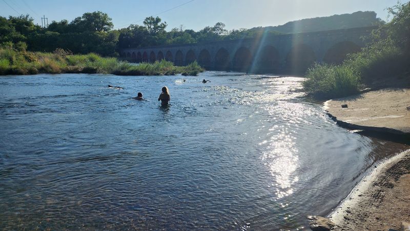 Swimming Holes Beneath Historic Limestone Arches