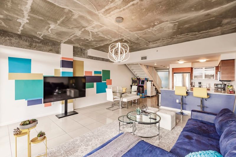 Playful loft with arcade games and sunny terraces