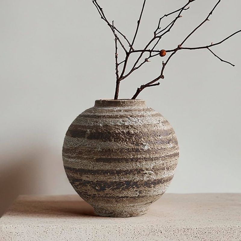 24 Inspiring Ways To Blend Rustic Boho And Farmhouse Styles In Your Living Room - Decor Hint Handmade pottery pieces