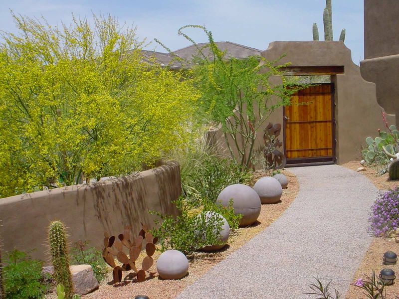 Courtyard Entrances With Desert Plants And Sculptural Elements
