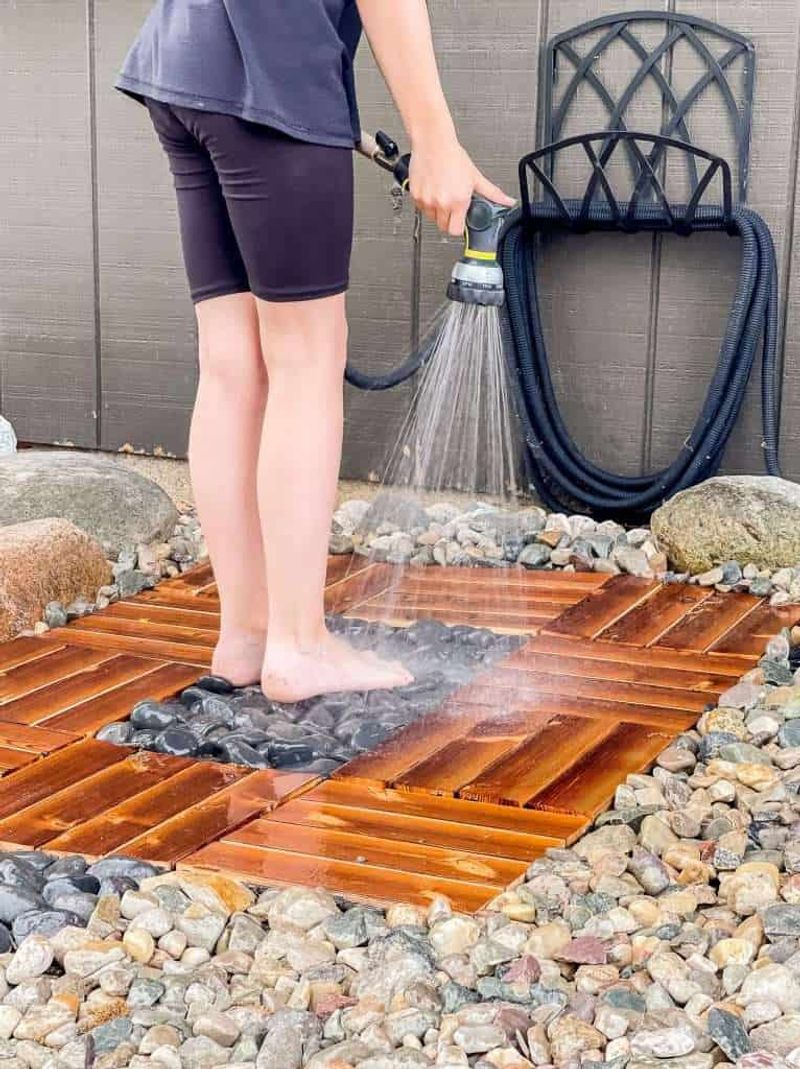 25 Outdoor Shower Ideas That Give Off BIG Beach House Energy - Decor Hint Beach Stone Foot Rinse