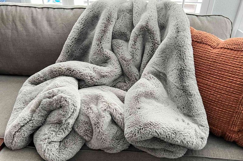 Designers Reveal 15 Home Decor Choices Falling Out Of Favor - Decor Hint Faux Fur Throws
