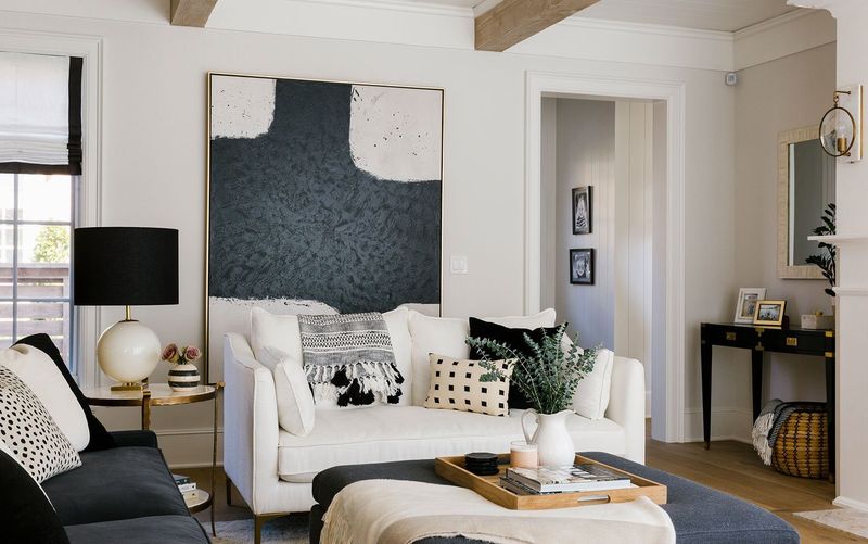 20 Quick Changes To Elevate Your Living Room - Decor Hint Hang Statement Art