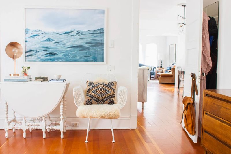 10 Ways You’re Accidentally Making Your Home Look Tacky And 6 More To Watch Out For - Decor Hint Low-hanging artwork