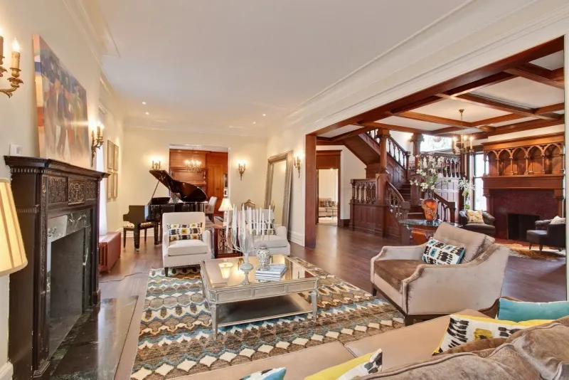 Formal Living Room Boasts Stained Glass Windows And Ornate Fireplace