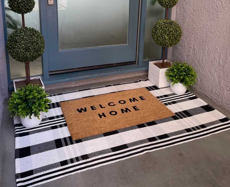 9 Items That Designers Say Should Never Be On Your Porch (And 8 That Should Be) - Decor Hint Clean Welcome Mat or Layered Doormats