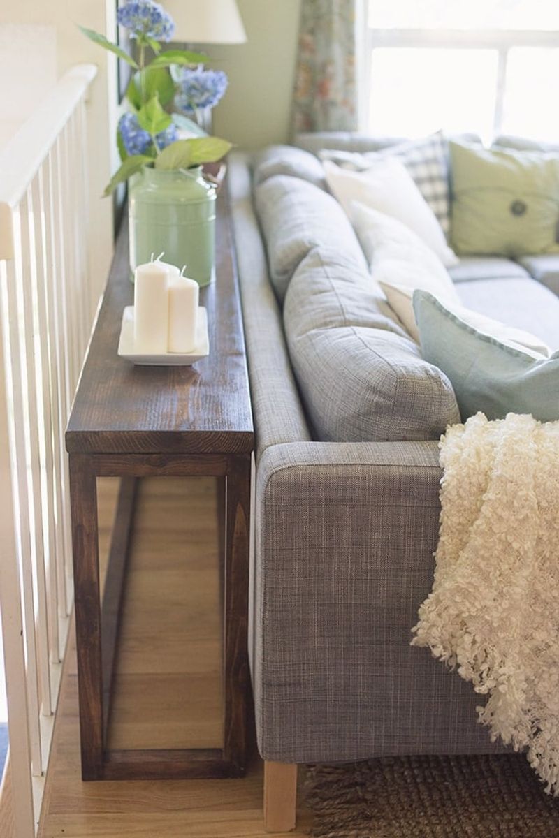 16 Tiny Room Layouts That Just Work - Decor Hint Narrow Console Table Behind Sofa for Storage