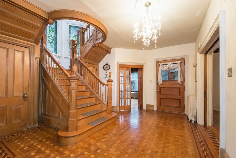 Inside A 1899 Queen Anne Victorian In Poughkeepsie With Stained Glass And Intricate Woodwork - Decor Hint Intricate Oak Staircase In Entrance Hall