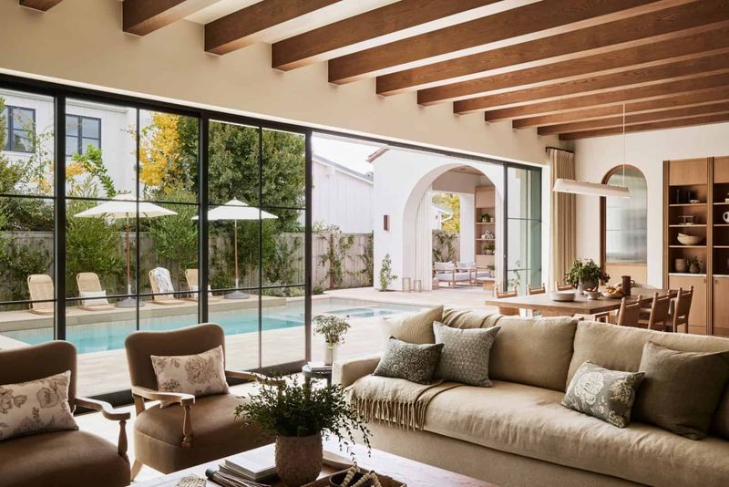 14 Mediterranean-Inspired Living Spaces That Bring A European Getaway Home - Decor Hint Room Featuring Large Windows For Natural Light