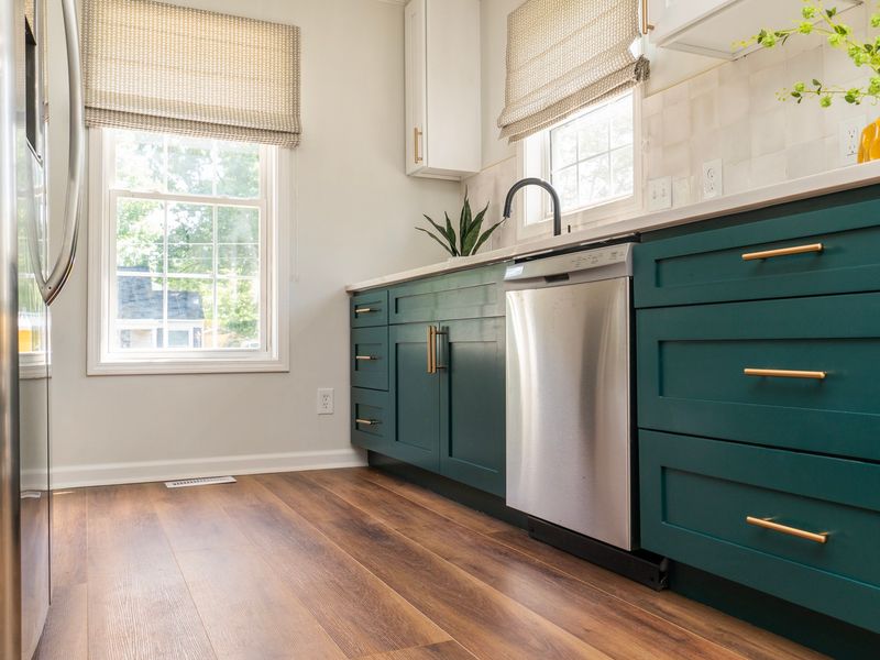 Green Cabinetry with Black Accents