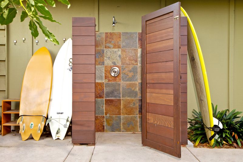25 Outdoor Shower Ideas That Give Off BIG Beach House Energy - Decor Hint Outdoor Shower with Surfboard Rack