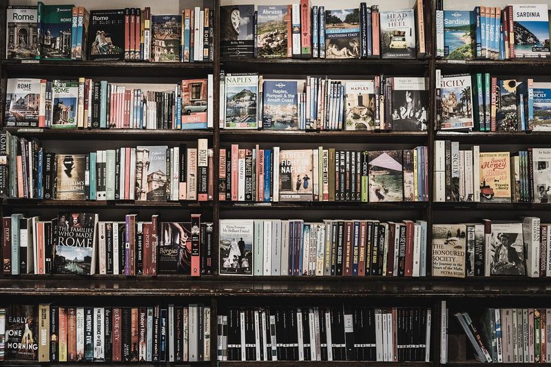 12 Things Making Your House Look Cluttered – Even When It's Clean - Decor Hint Overflowing Bookshelves