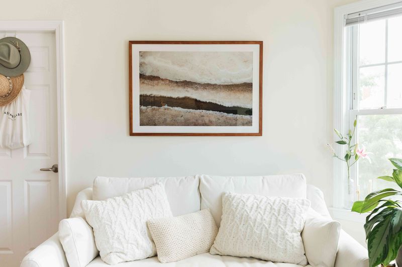 15 Decor Fixes For Rooms That Feel 'Off' - Decor Hint Hang Artwork at Eye Level