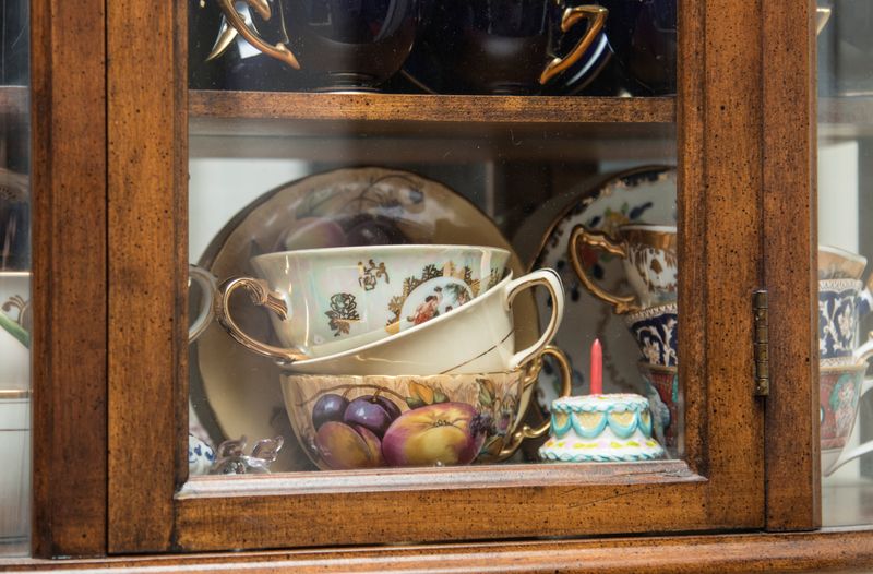 18 Nostalgic Home Trends That Ruin Boomers' Homes - Decor Hint China Cabinets Full Of Collectibles
