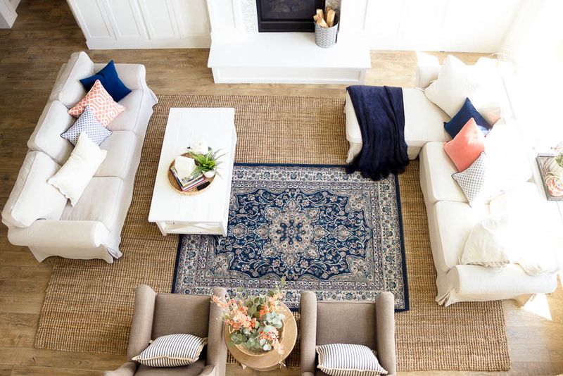 21 Clever Ways To Update Your Living Room Without Replacing The Furniture - Decor Hint Layer Area Rugs