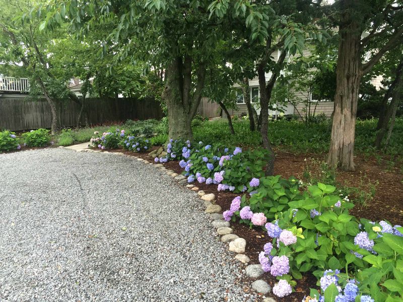 7 Coastal-Inspired Curb Appeal Ideas From Florida, And 5 Even Better Ones - Decor Hint Gravel Pathways That Sound Like The Beach